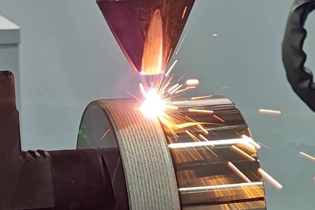 Laser Cladding Head During Metal Deposition
